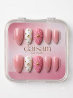 Blush Bloom press-on nails worn on model Daisam